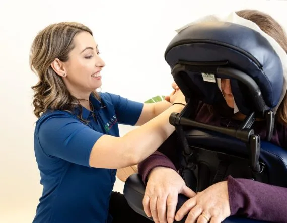 W.I.S.E. corporate chair massage at a workplace wellness event